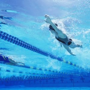 Squad swimmer swimming freestyle